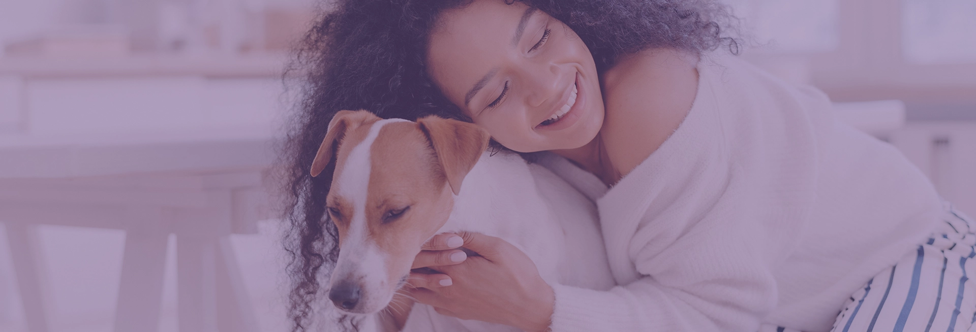 A girl hugging her dog A girl hugging her dog